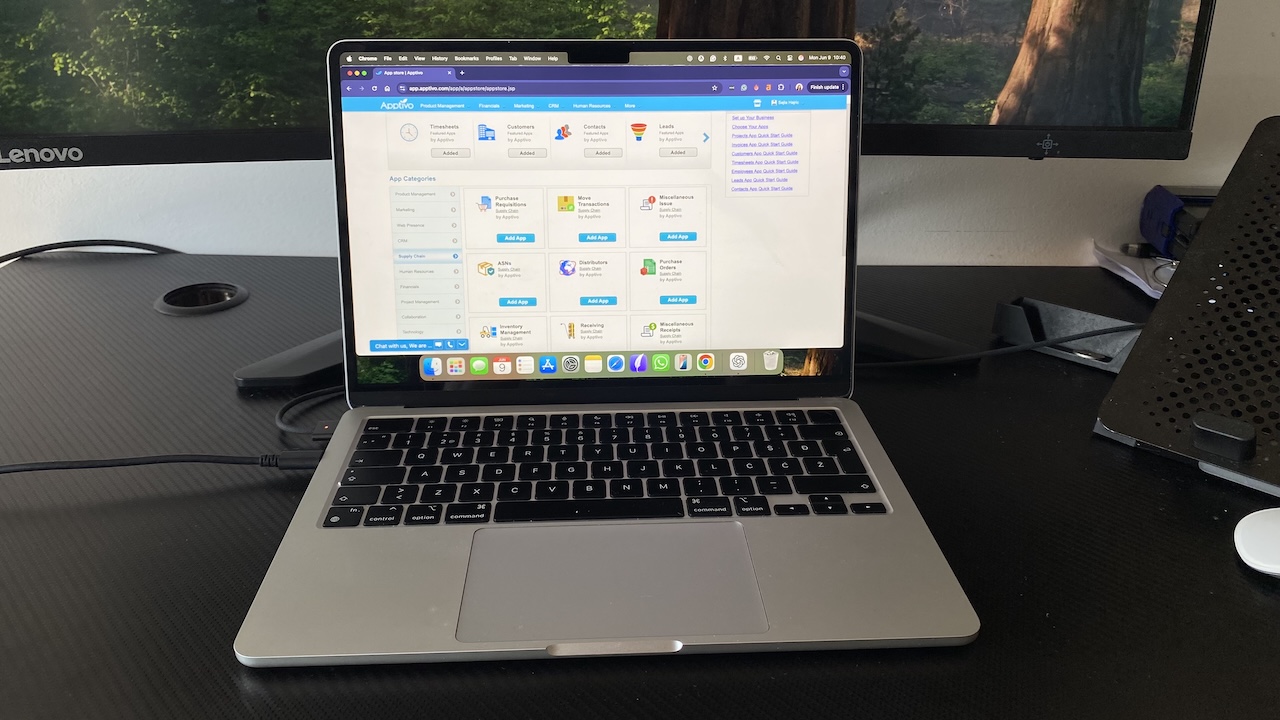 Apptivo app marketplace on laptop screen showing modular business tools for CRM, finance, HR, and project management