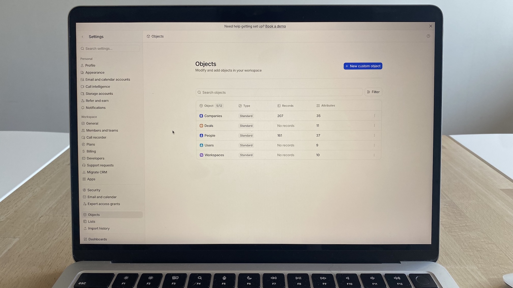 Attio CRM object settings showing list of object types with record and attribute counts