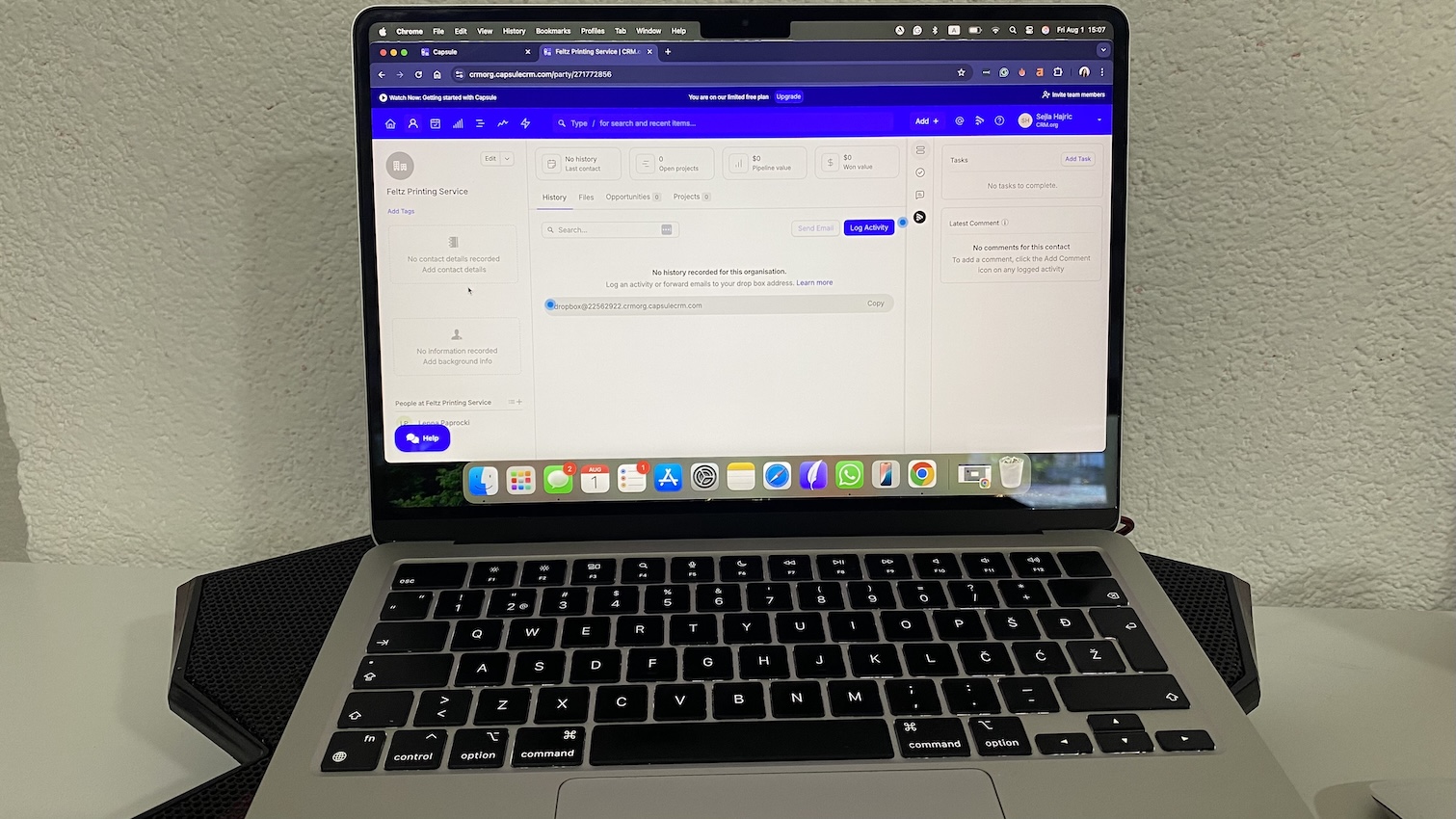Capsule CRM contact record view showing organization profile with tabs for history, files, opportunities, and projects.