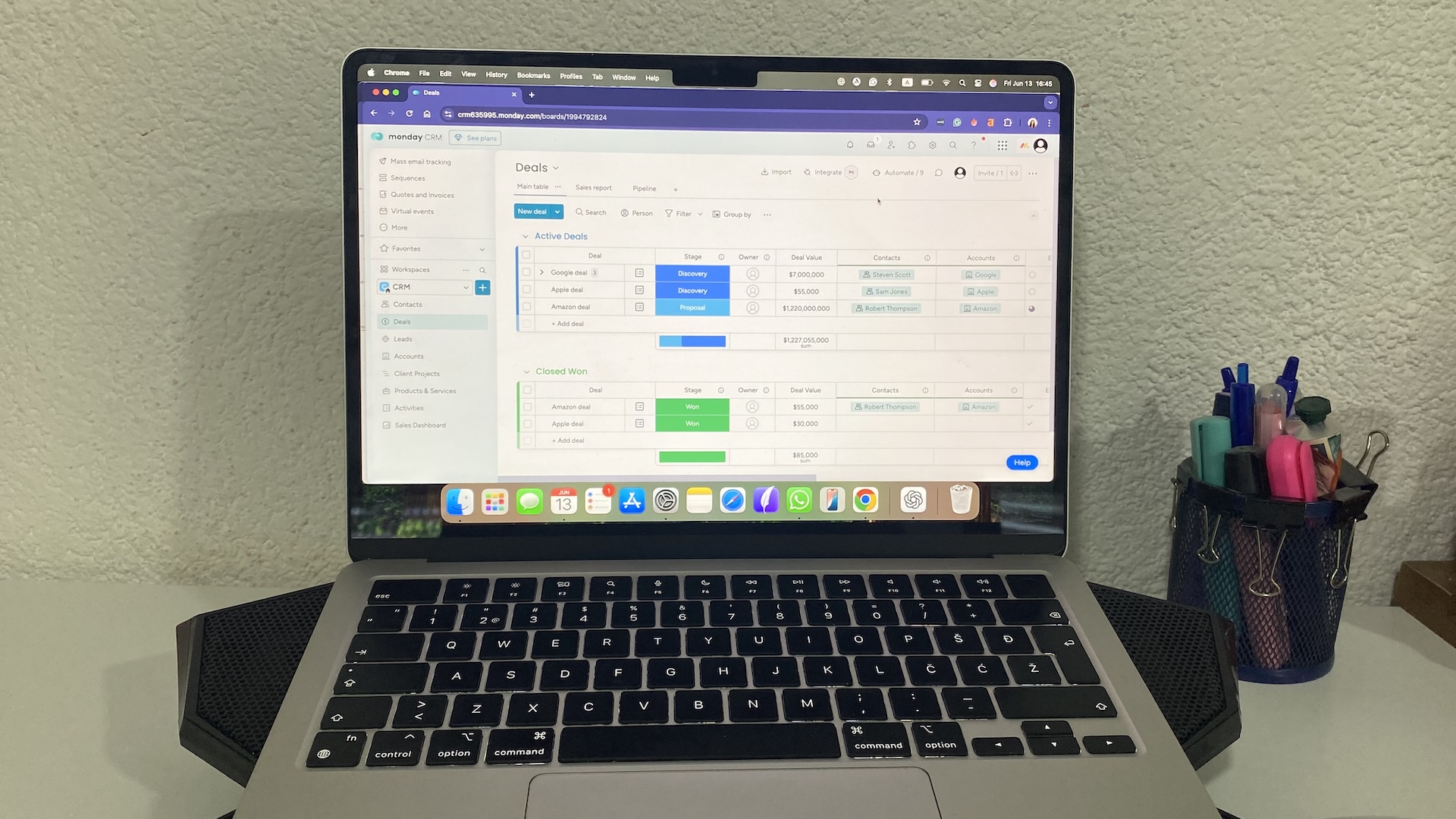 Monday CRM’s Deals board with sales pipeline stages, owners, deal values, and company associations.