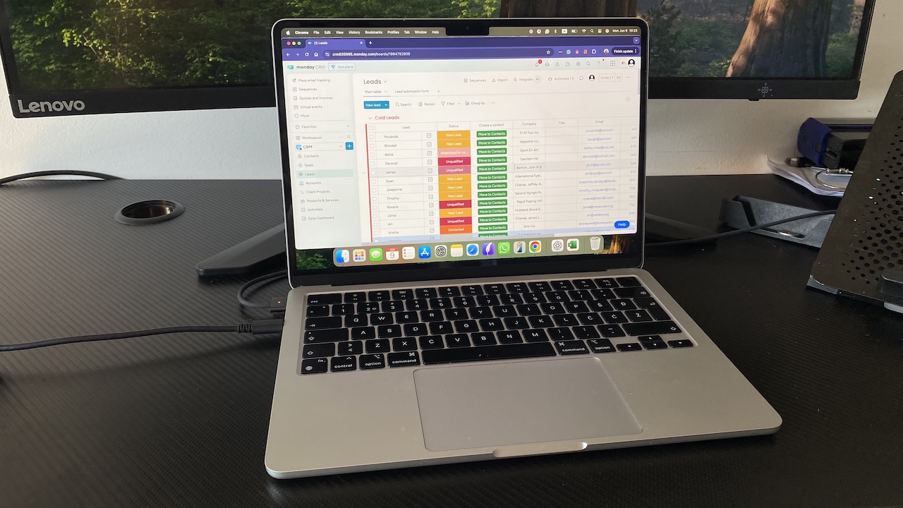 monday CRM leads board on laptop screen with status tracking, contact columns, and a visual workflow layout
