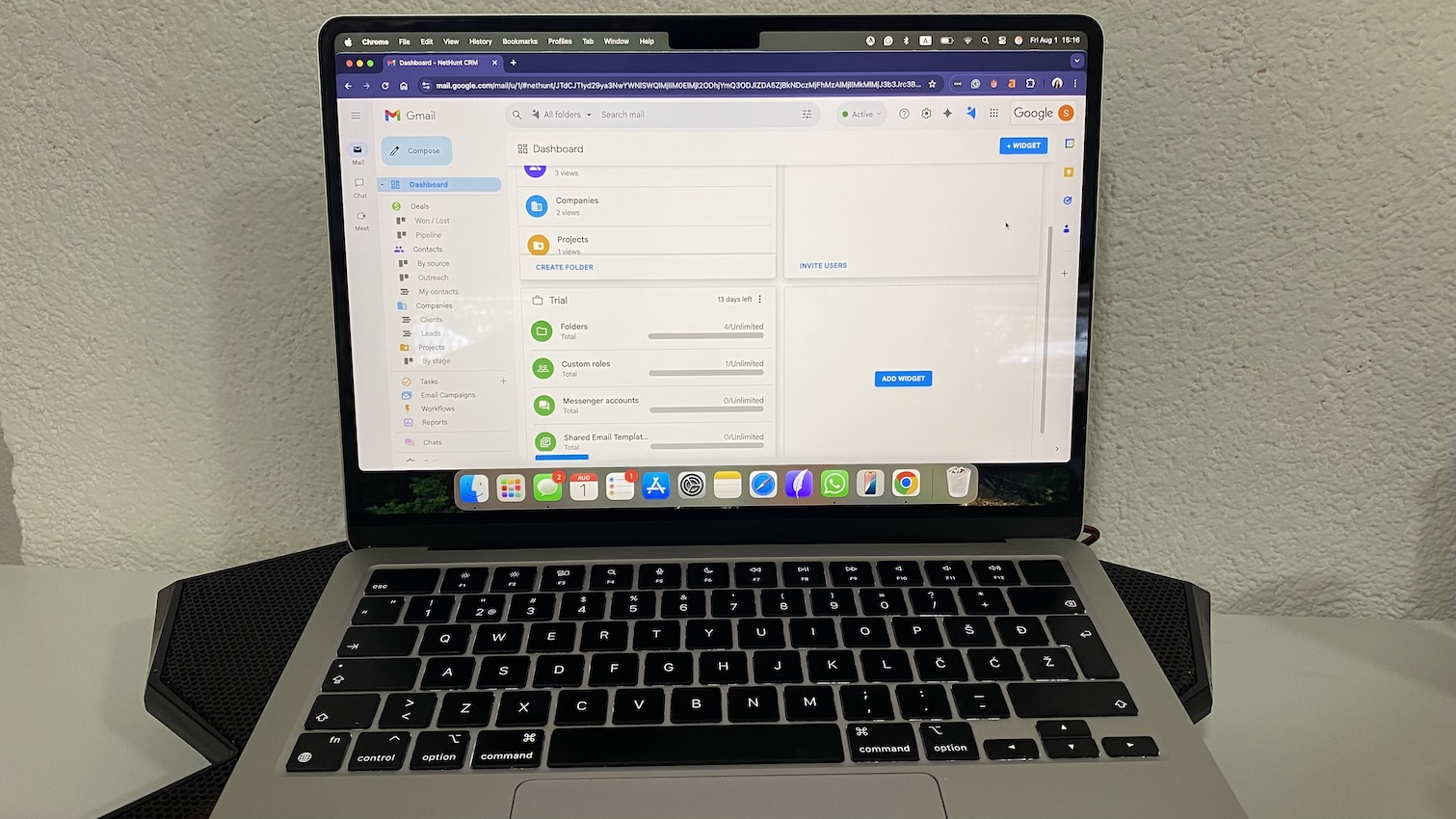NetHunt CRM dashboard inside Gmail showing navigation menu with deals, contacts, leads, and trial progress