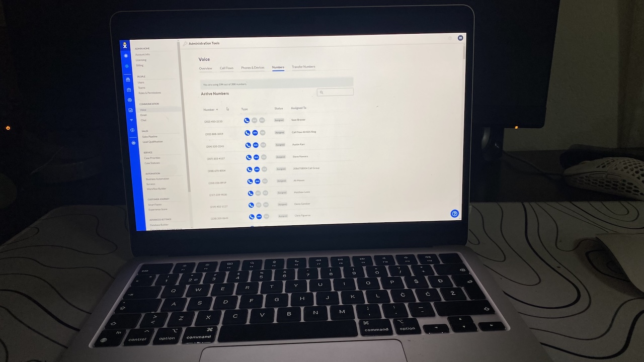 List of active phone numbers in Nextiva, each number assigned to team members in the Numbers tab.