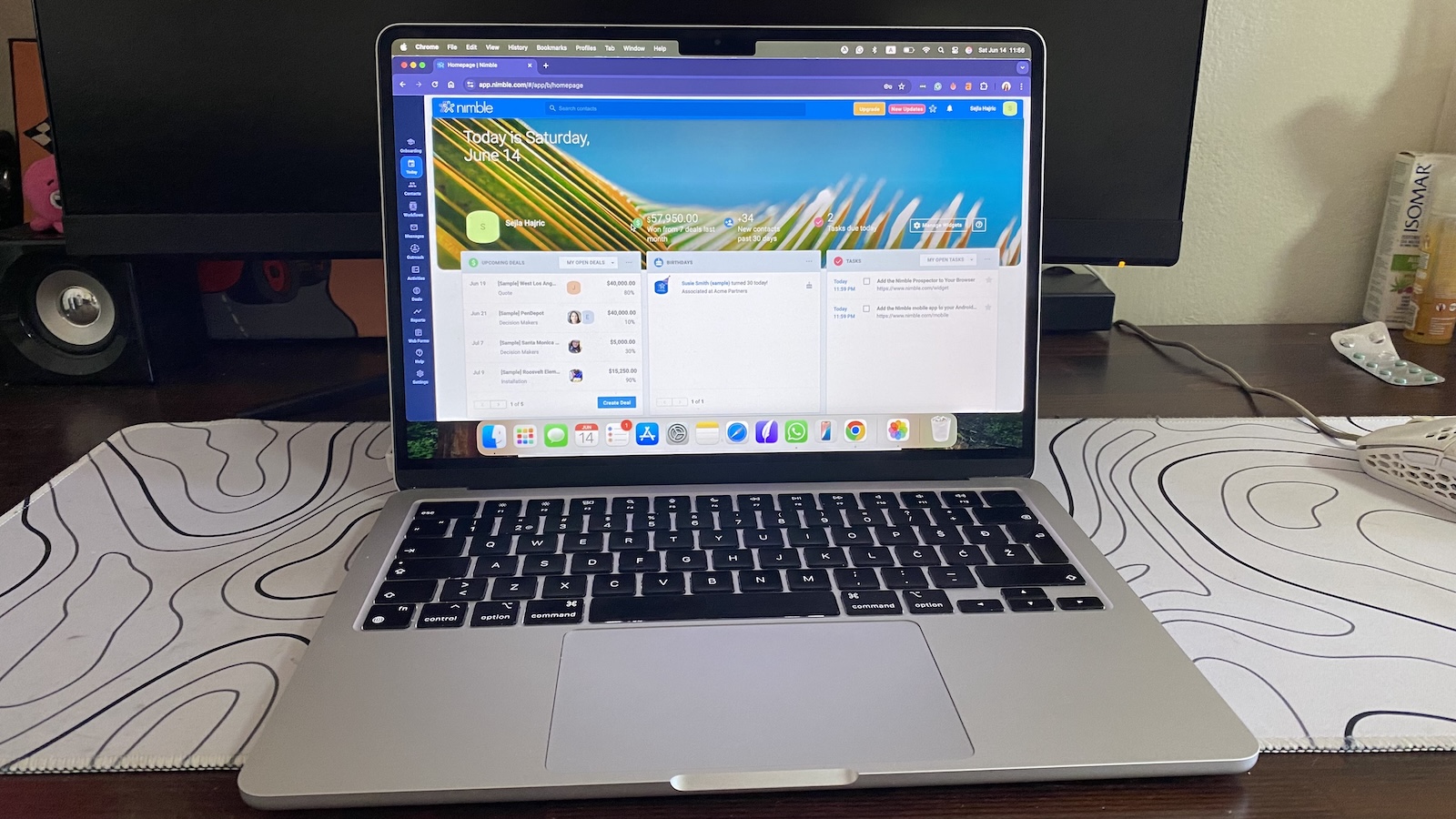 Nimble CRM dashboard with deals, tasks, and contact reminders visible, featuring a bright background and navigation sidebar.