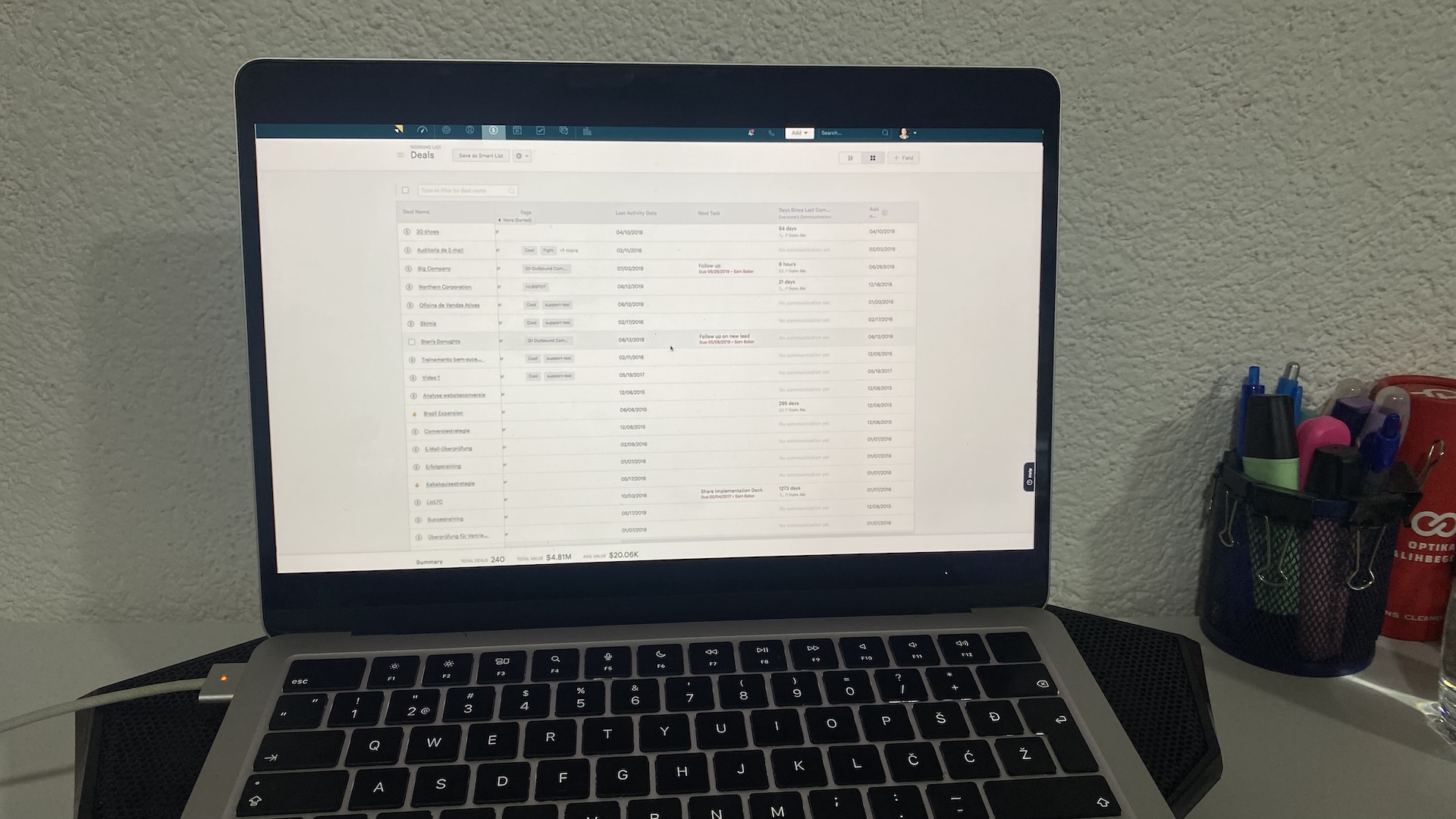 Zendesk Sell deals dashboard showing a list view of sales opportunities with details like value, tags, and activity dates.