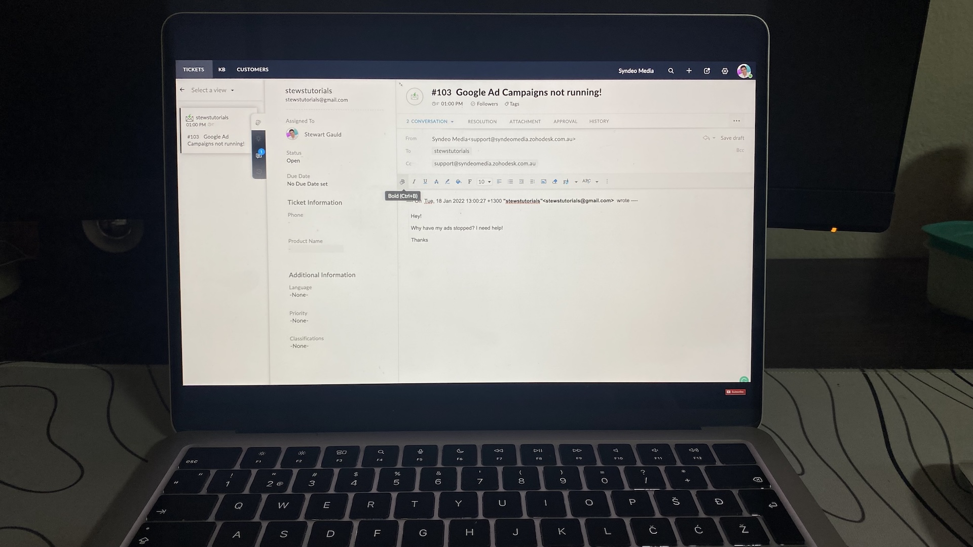 Zoho Desk ticket screen showing customer email about Google Ads issue with reply options and ticket details visible.