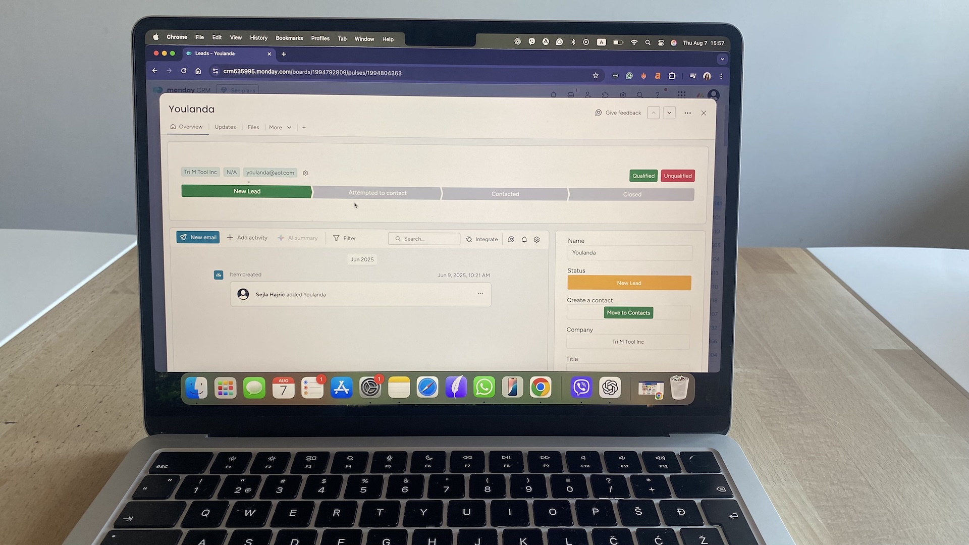 Lead progress view in Monday CRM showing contact status, activity feed, and deal management options.