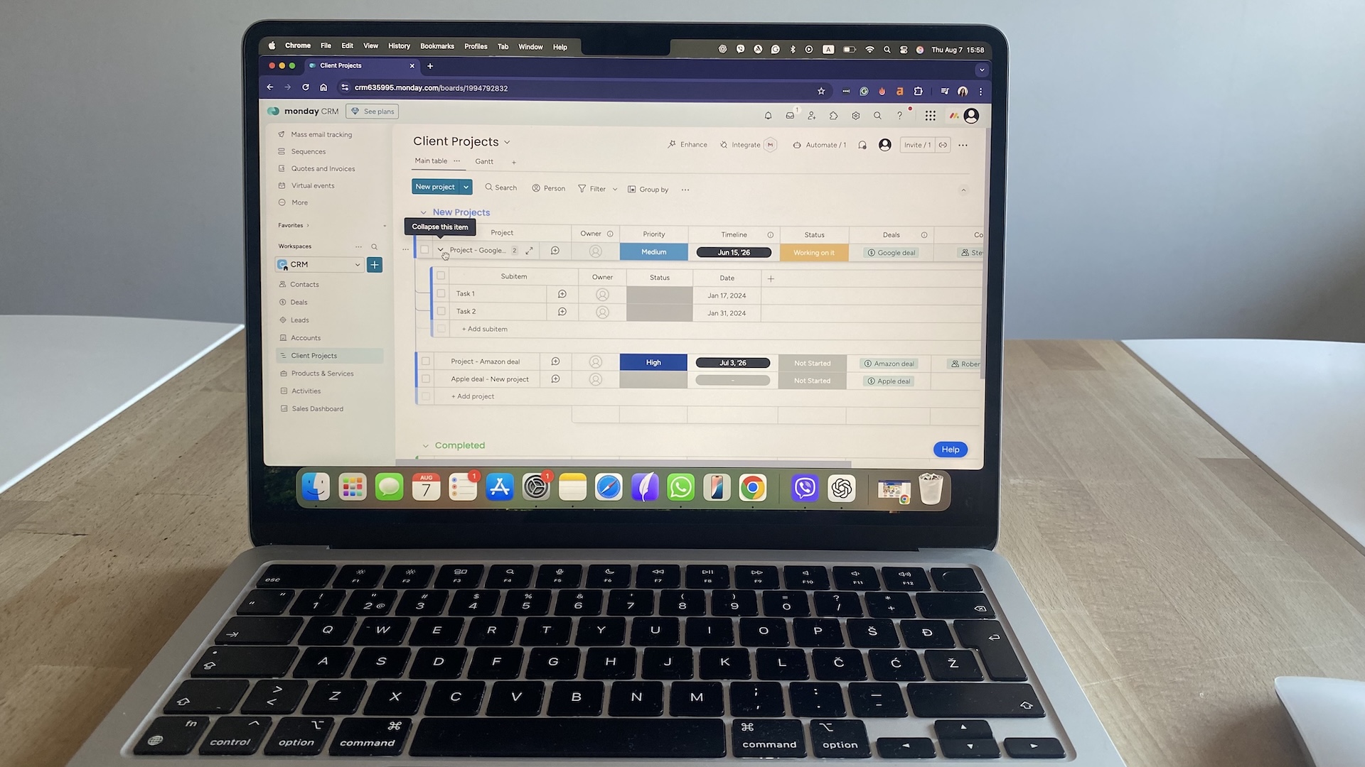 Client Projects board in monday CRM showing project status, timelines, and linked deals for account tracking.