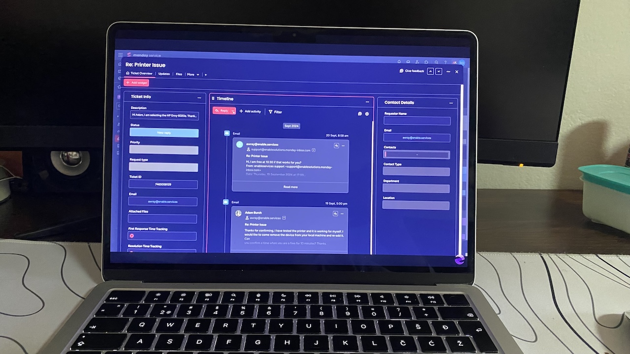 Monday Service CRM ticket dashboard showing ticket details, timeline of replies, and customer contact information.